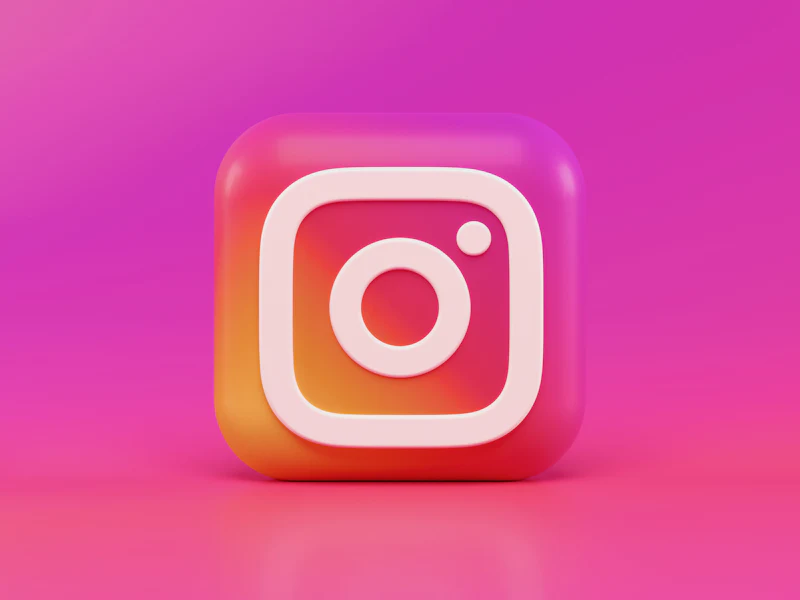 Instagram app icon on a pink background